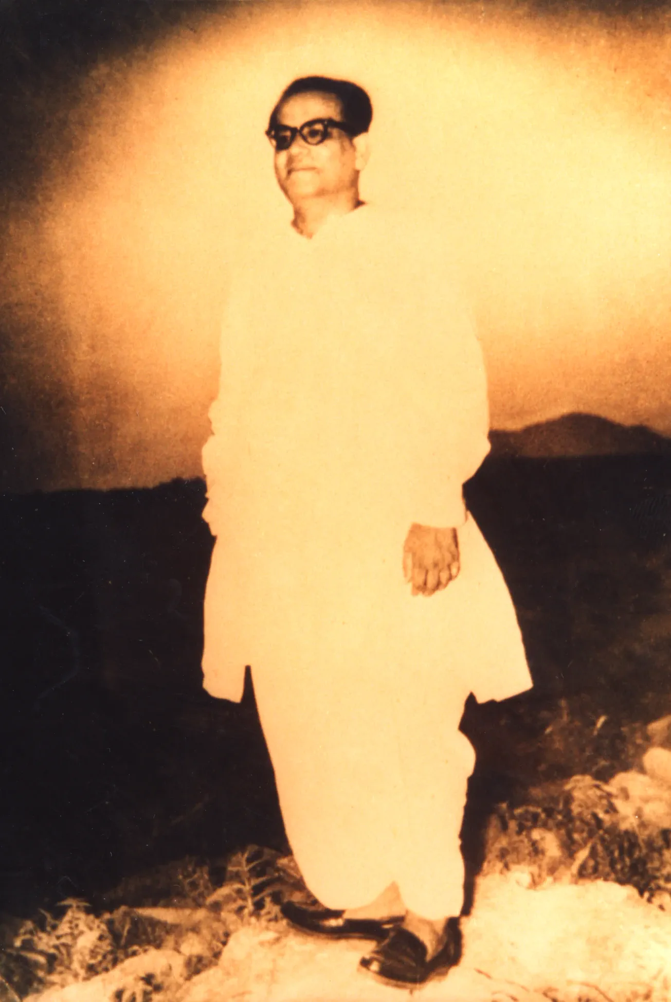 Shrii Shrii Anandamurti standing in golden light