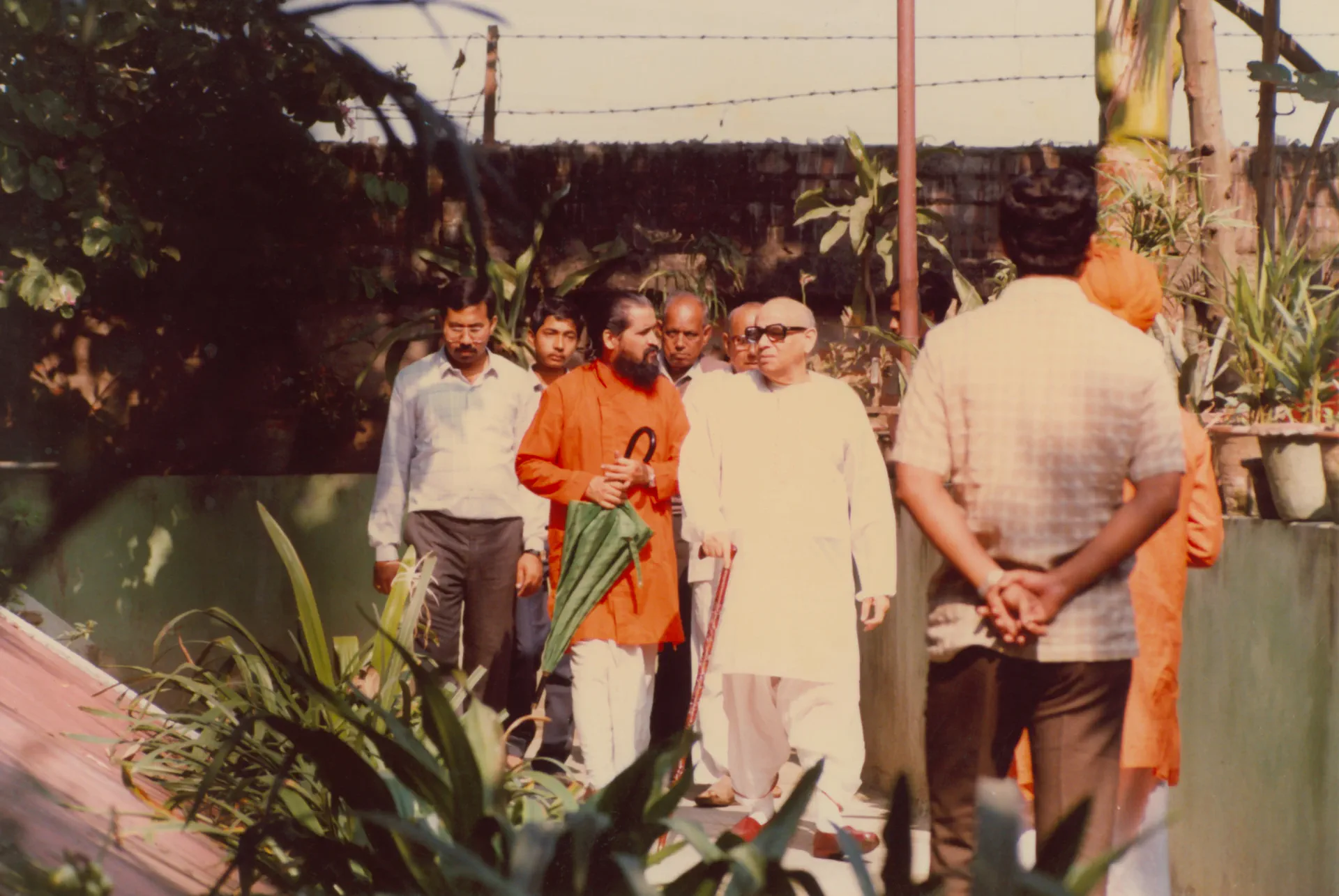Shrii Shrii Anandamurti in a garden with devotees